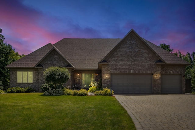 13703 47th St NE, Saint Michael, MN 55376 - view of front of home with a garage, brick siding, a front yard, driveway, and a shingled roof