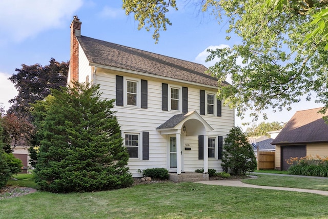 506 6th Ave SW, Austin, MN 55912 - colonial inspired home with a chimney and roof with shingles