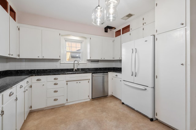 506 6th Ave SW, Austin, MN 55912 - kitchen featuring freestanding refrigerator, stainless steel dishwasher, tasteful backsplash, and white cabinetry