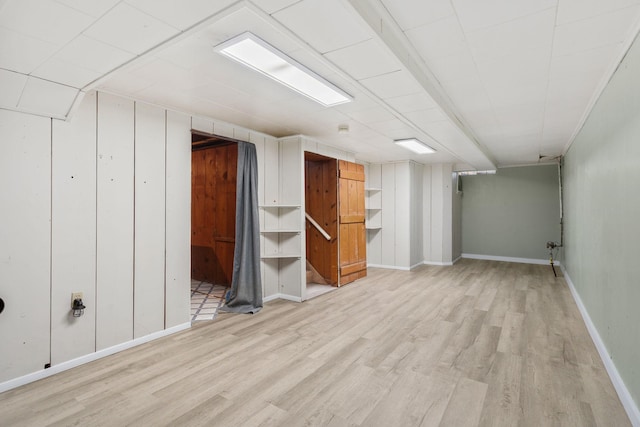 506 6th Ave SW, Austin, MN 55912 - finished below grade area featuring light wood-type flooring and baseboards