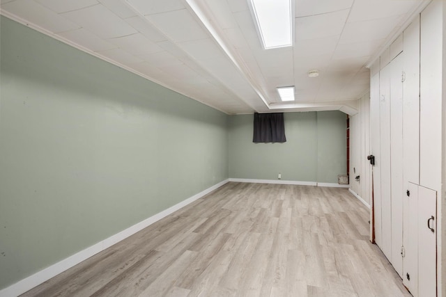 506 6th Ave SW, Austin, MN 55912 - finished basement featuring light wood finished floors and baseboards