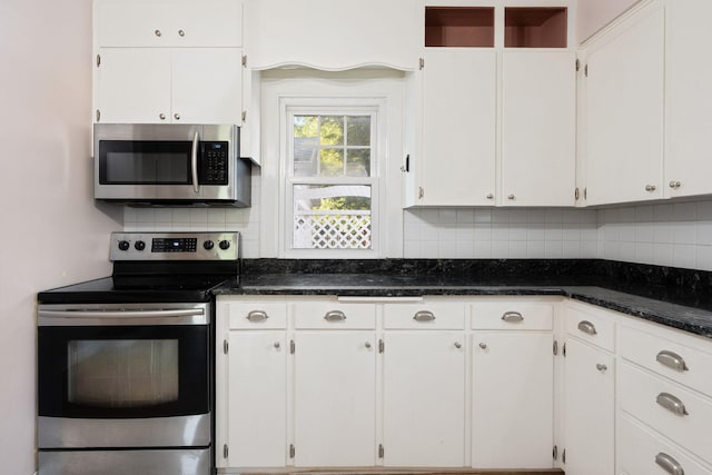506 6th Ave SW, Austin, MN 55912 - kitchen with appliances with stainless steel finishes, backsplash, and white cabinets