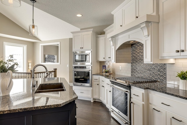 3163 Christopher Ln, Shoreview, MN 55126 - kitchen with stainless steel appliances, decorative backsplash, dark wood-type flooring, dark stone countertops, and vaulted ceiling
