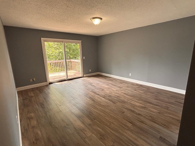 2905 Flag Ave N, New Hope, MN 55427 - empty room featuring dark wood-type flooring and a textured ceiling
