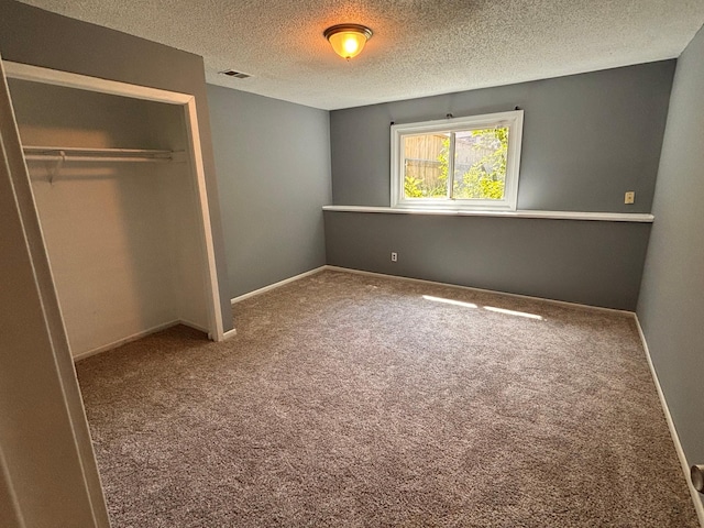 2905 Flag Ave N, New Hope, MN 55427 - unfurnished bedroom with carpet flooring, a closet, and a textured ceiling
