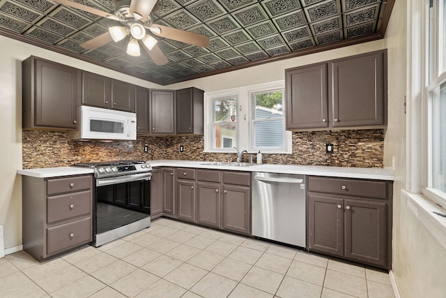 1502 Maywood St, Saint Paul, MN 55117 - kitchen featuring stainless steel appliances, an ornate ceiling, plenty of natural light, decorative backsplash, and light countertops
