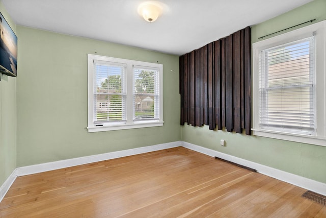 1502 Maywood St, Saint Paul, MN 55117 - spare room featuring light wood-style flooring and baseboards
