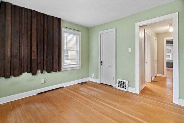 1502 Maywood St, Saint Paul, MN 55117 - spare room with baseboards and light wood-style flooring