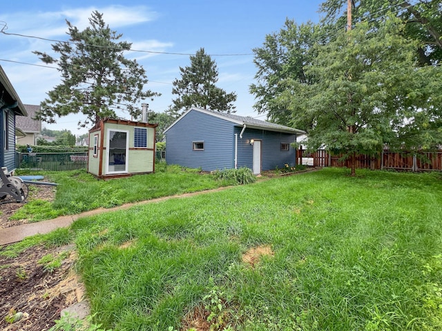 1502 Maywood St, Saint Paul, MN 55117 - fenced backyard featuring an outdoor structure
