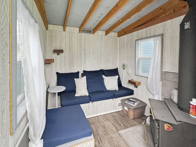 1502 Maywood St, Saint Paul, MN 55117 - living room with wood finished floors, beam ceiling, and wood walls