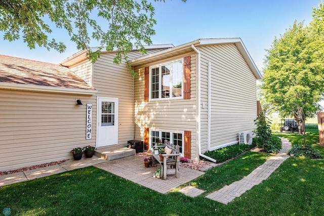 3746 10th St N, Fargo, ND 58102 - back of house with a yard and a patio area