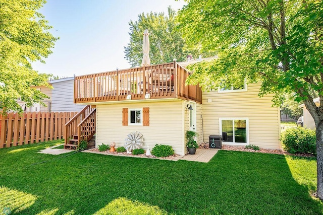 3746 10th St N, Fargo, ND 58102 - rear view of property with stairs and a wooden deck