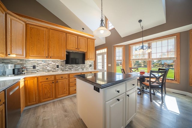 35337 County 24th Blvd, Warsaw Twp, MN 55009 - kitchen with dishwasher, light wood finished floors, tasteful backsplash, hanging light fixtures, and lofted ceiling