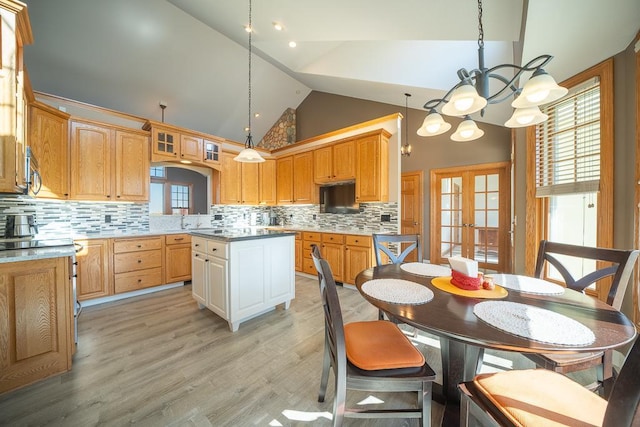 35337 County 24th Blvd, Warsaw Twp, MN 55009 - kitchen with a chandelier, french doors, tasteful backsplash, high vaulted ceiling, and light wood-type flooring