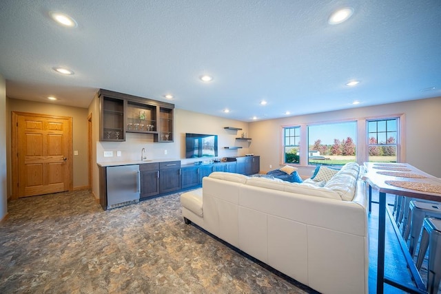 35337 County 24th Blvd, Warsaw Twp, MN 55009 - living area featuring wet bar, recessed lighting, a textured ceiling, and stone finish flooring