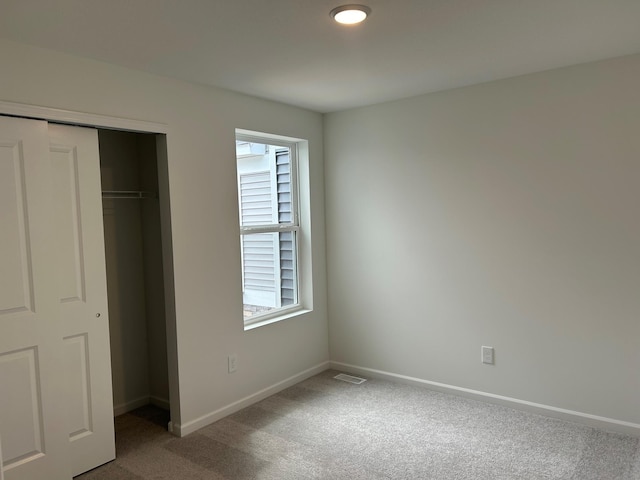 10385 Glacier Ln N, Maple Grove, MN 55369 - unfurnished bedroom with carpet flooring, multiple windows, and a closet