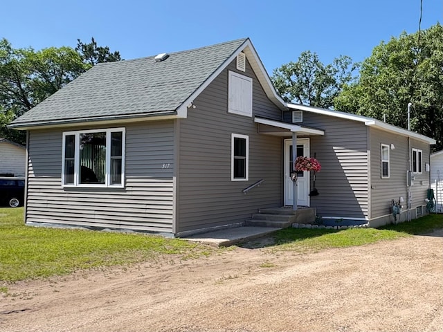 317 2nd St NE, Menahga, MN 56464 - view of front of property featuring driveway and roof with shingles