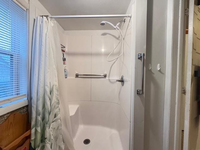 317 2nd St NE, Menahga, MN 56464 - bathroom with a stall shower and healthy amount of natural light