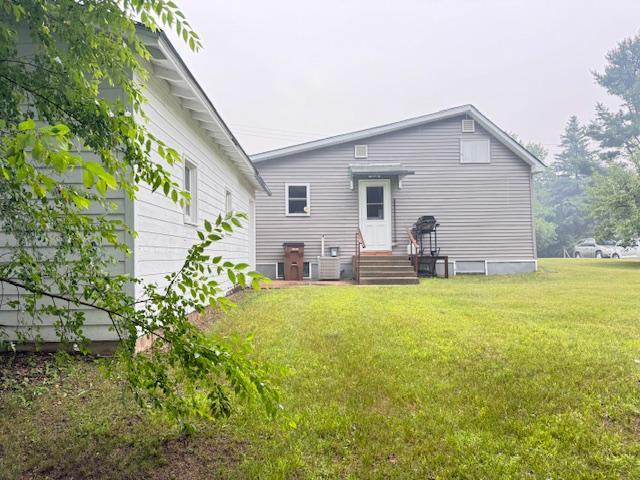 317 2nd St NE, Menahga, MN 56464 - back of property with a lawn