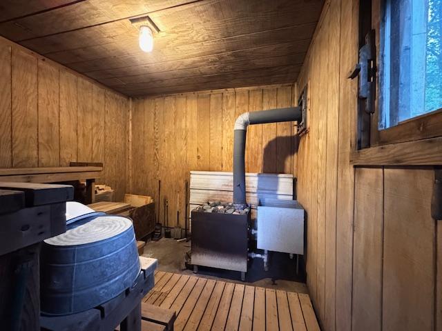 317 2nd St NE, Menahga, MN 56464 - relaxing sauna with wooden walls, wooden ceiling, and wood-type flooring