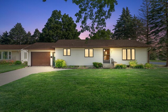 401 Douglas St, Arlington, MN 55307 - single story home featuring a garage, concrete driveway, and a front lawn