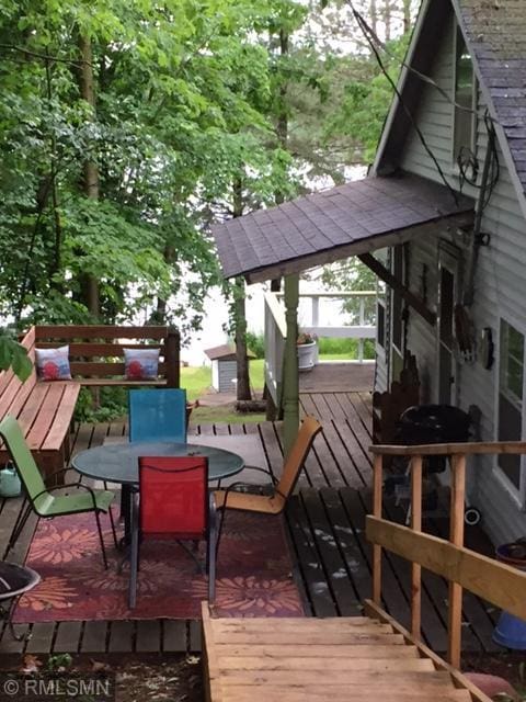 5539 Dahl Rd, Cromwell, MN 55726 - wooden terrace featuring outdoor dining space