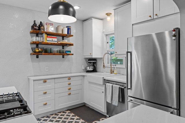 5712 Grand Ave S, Minneapolis, MN 55419 - kitchen with appliances with stainless steel finishes, light countertops, and white cabinets
