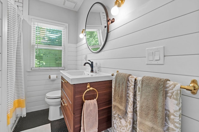 5712 Grand Ave S, Minneapolis, MN 55419 - bathroom with vanity, wood walls, a wainscoted wall, and a shower with shower curtain