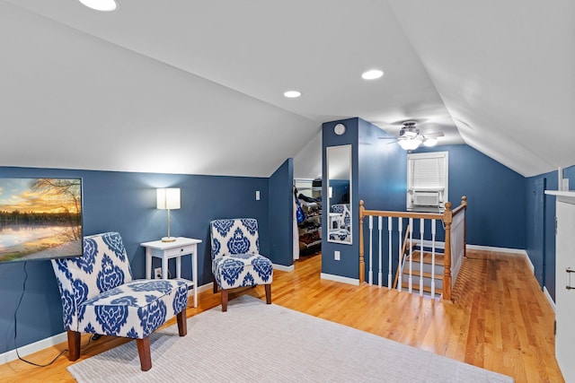 5712 Grand Ave S, Minneapolis, MN 55419 - living area with an upstairs landing, wood finished floors, lofted ceiling, a ceiling fan, and cooling unit