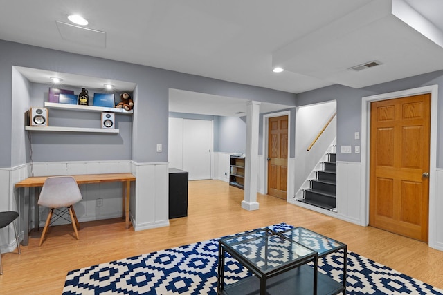 5712 Grand Ave S, Minneapolis, MN 55419 - living room with wood finished floors, stairway, wainscoting, recessed lighting, and built in study area