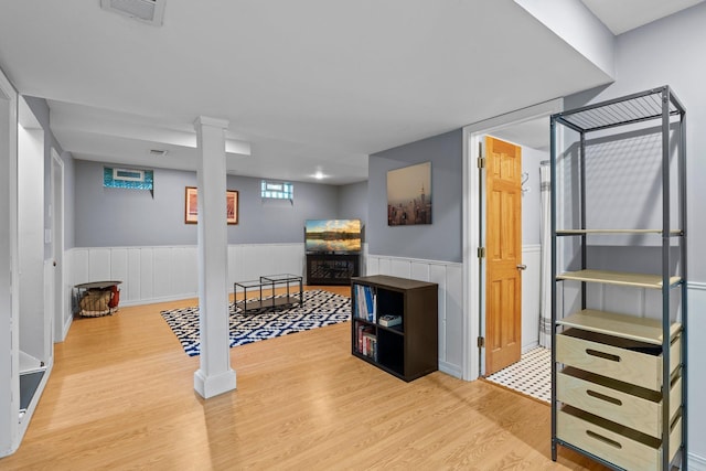 5712 Grand Ave S, Minneapolis, MN 55419 - bedroom featuring light wood finished floors and a wainscoted wall