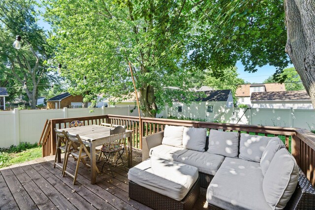 5712 Grand Ave S, Minneapolis, MN 55419 - wooden deck featuring an outdoor living space, outdoor dining area, and a fenced backyard