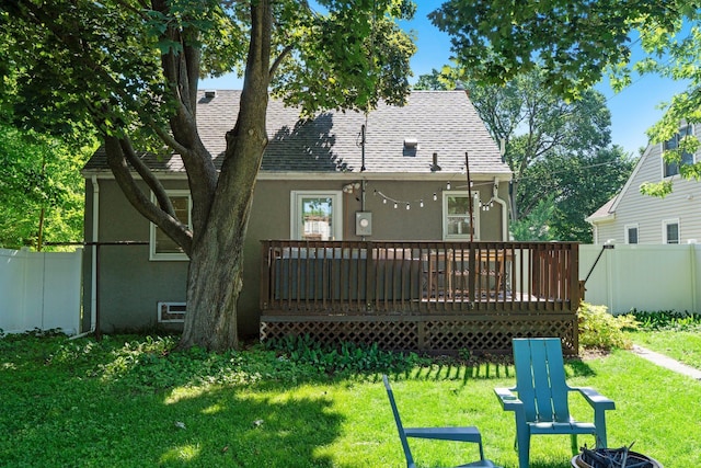 5712 Grand Ave S, Minneapolis, MN 55419 - back of property with stucco siding, a wooden deck, and roof with shingles