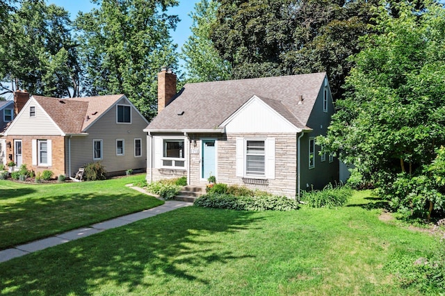 5712 Grand Ave S, Minneapolis, MN 55419 - view of front of home featuring stone siding, a front lawn, a chimney, and a shingled roof