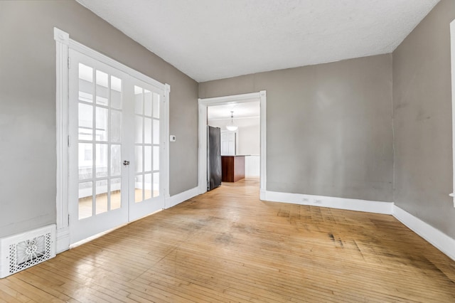 515 Lincoln St, Winona, MN 55987 - empty room featuring wood-type flooring and french doors