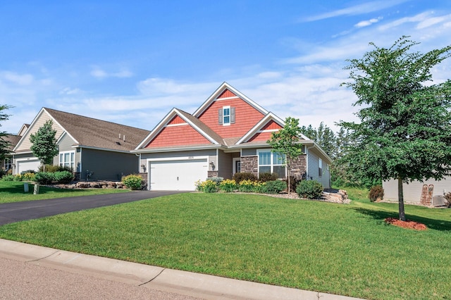 4870 Copper Ridge Dr, Woodbury, MN 55129 - craftsman-style house with driveway, stone siding, a front lawn, and a garage