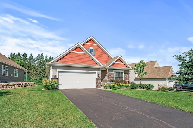 4870 Copper Ridge Dr, Woodbury, MN 55129 - craftsman-style house with driveway, a front lawn, stone siding, and a garage