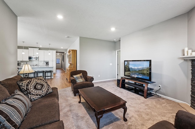 4870 Copper Ridge Dr, Woodbury, MN 55129 - living room with recessed lighting, a fireplace, and light carpet