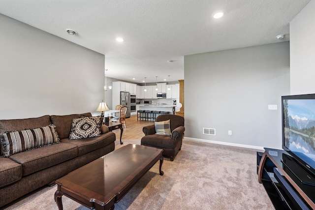 4870 Copper Ridge Dr, Woodbury, MN 55129 - living room featuring recessed lighting and light colored carpet