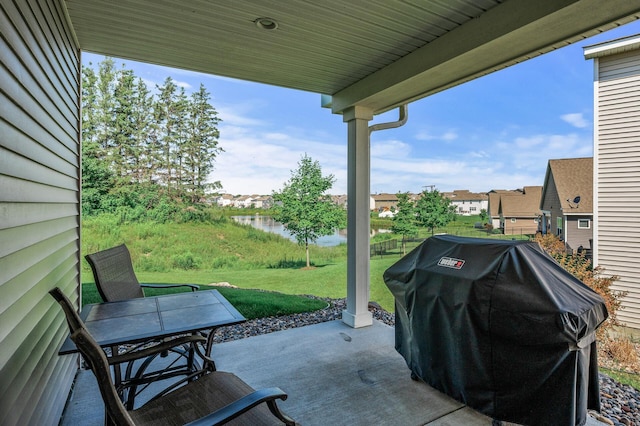 4870 Copper Ridge Dr, Woodbury, MN 55129 - view of patio with area for grilling, a water view, and a residential view