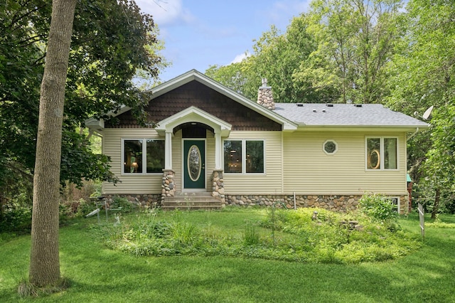 1610 63rd St, Chanhassen, MN 55331 - view of front of property with a front lawn, a chimney, and entry steps