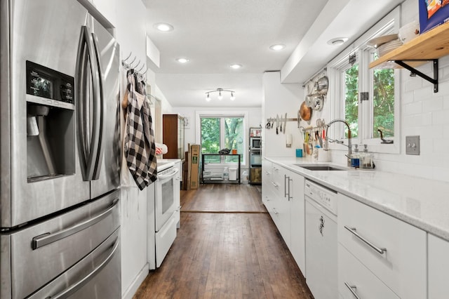 1610 63rd St, Chanhassen, MN 55331 - kitchen featuring white appliances, white cabinetry, dark wood finished floors, recessed lighting, and light stone counters