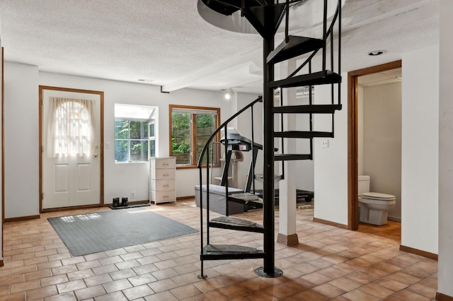 1610 63rd St, Chanhassen, MN 55331 - foyer with stairway and a textured ceiling