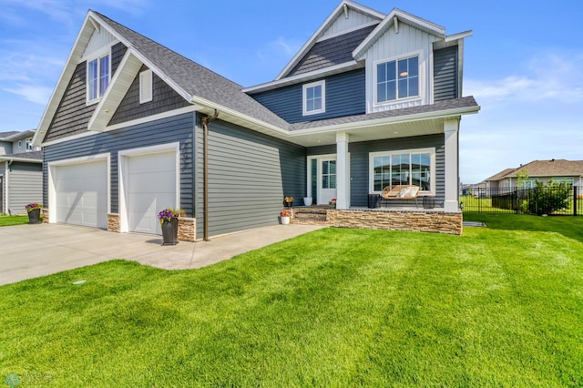 6176 Marigold Loop S, Fargo, ND 58104 - craftsman-style house with covered porch, concrete driveway, board and batten siding, an attached garage, and roof with shingles