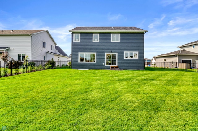 6176 Marigold Loop S, Fargo, ND 58104 - back of house with entry steps and a fenced backyard