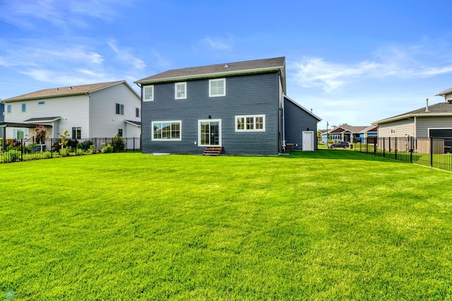 6176 Marigold Loop S, Fargo, ND 58104 - rear view of house featuring a fenced backyard and entry steps