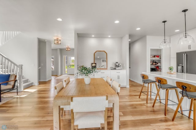 6176 Marigold Loop S, Fargo, ND 58104 - dining room with stairs, light wood-style floors, and recessed lighting
