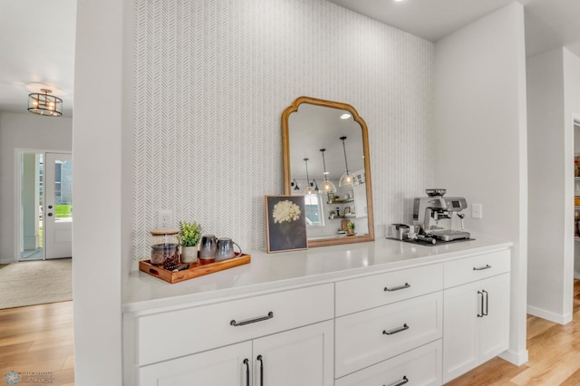 6176 Marigold Loop S, Fargo, ND 58104 - bar with light wood-style flooring and baseboards