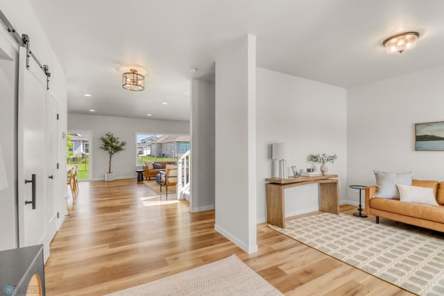 6176 Marigold Loop S, Fargo, ND 58104 - entryway with a barn door, light wood-style flooring, and recessed lighting