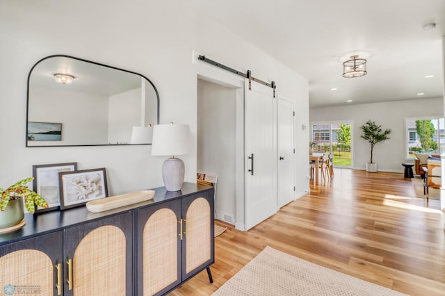 6176 Marigold Loop S, Fargo, ND 58104 - foyer featuring a barn door, light wood-style floors, and recessed lighting